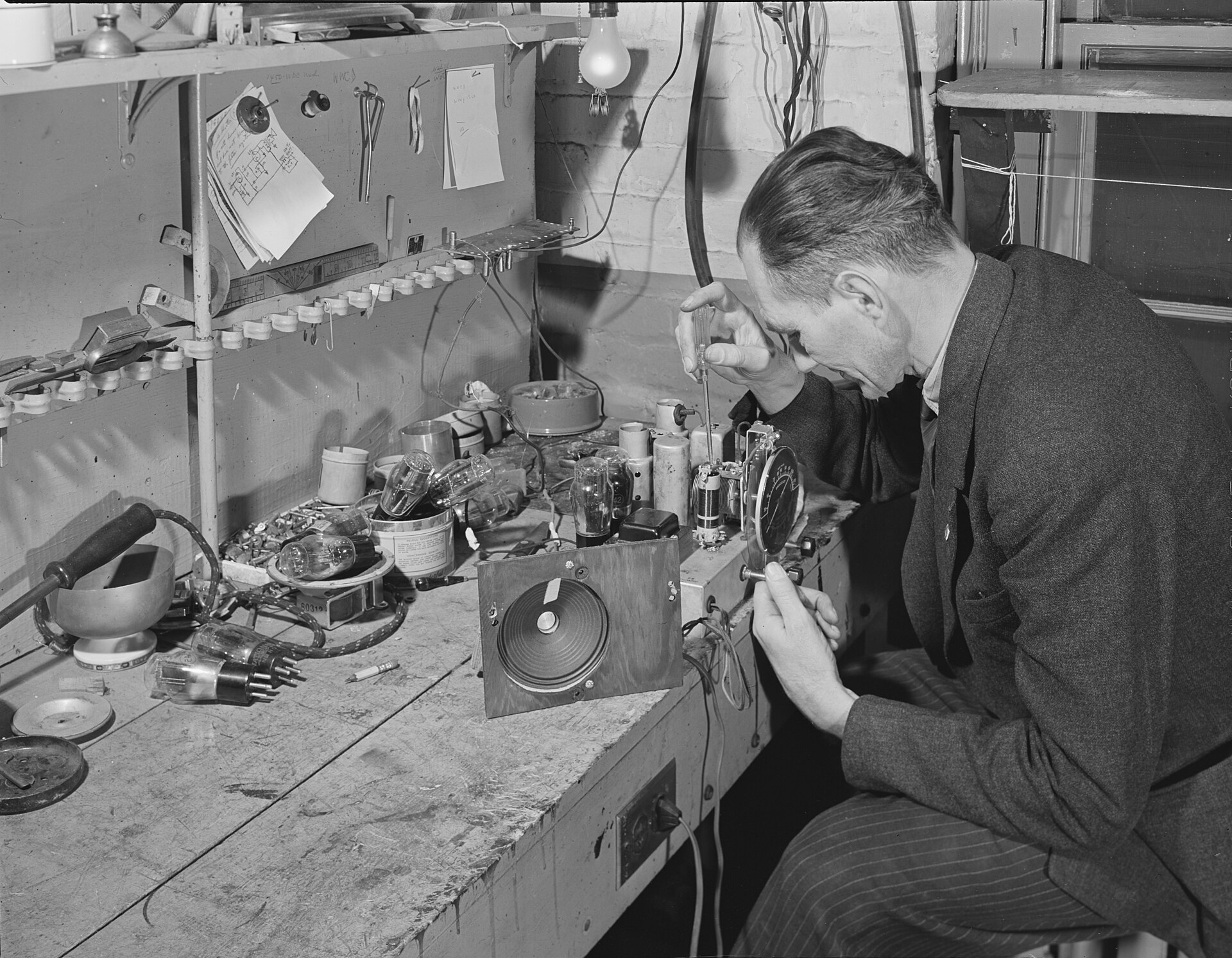 Archival black and white photograph of a radio repair bench, Washington D.C., 1942